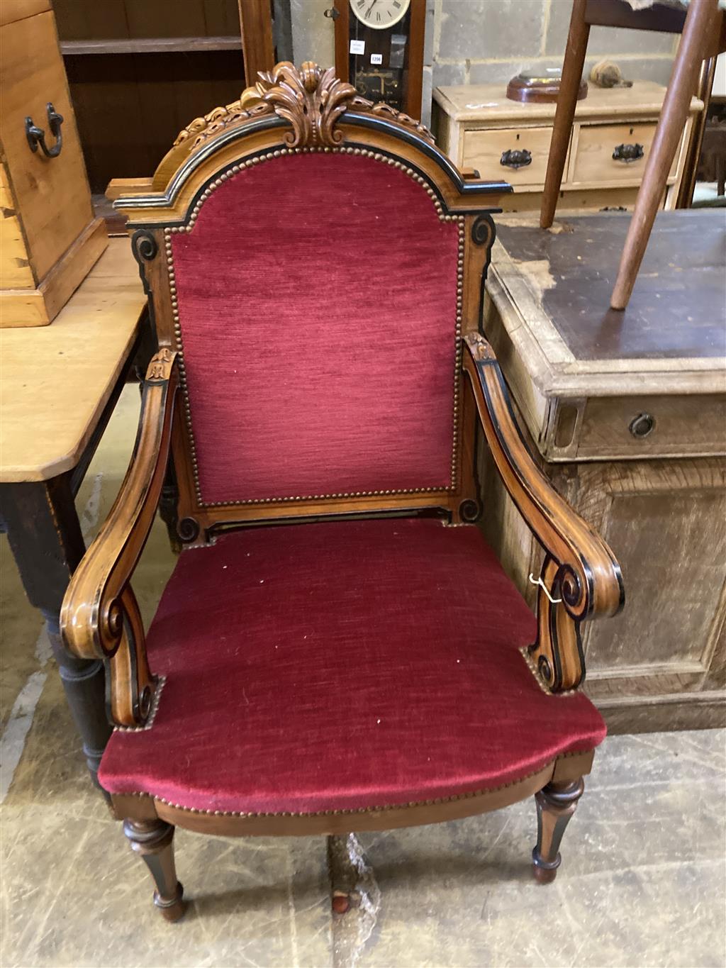 A pair of 19th century Continental carved walnut and ebonised chairs, width 63cm, depth 60cm, height 110cm